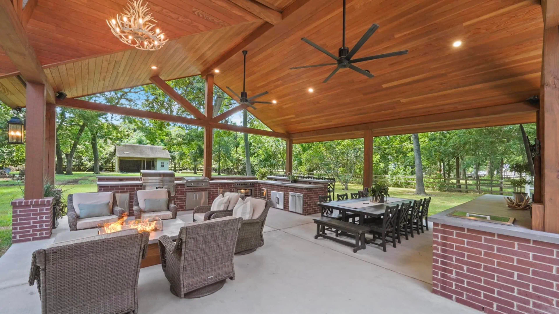 outdoor kitchen under huge wooden patio
